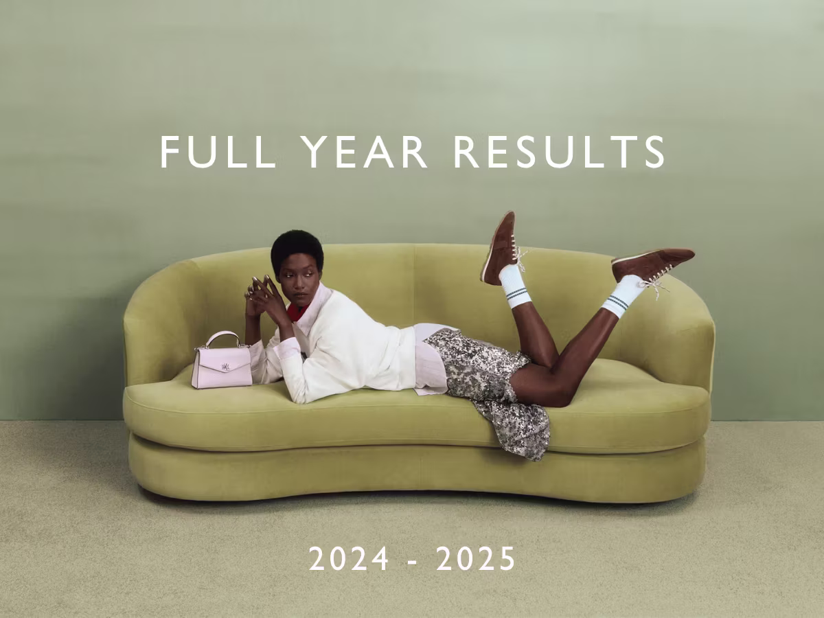 Person laying stomach down in couch in professional photograph