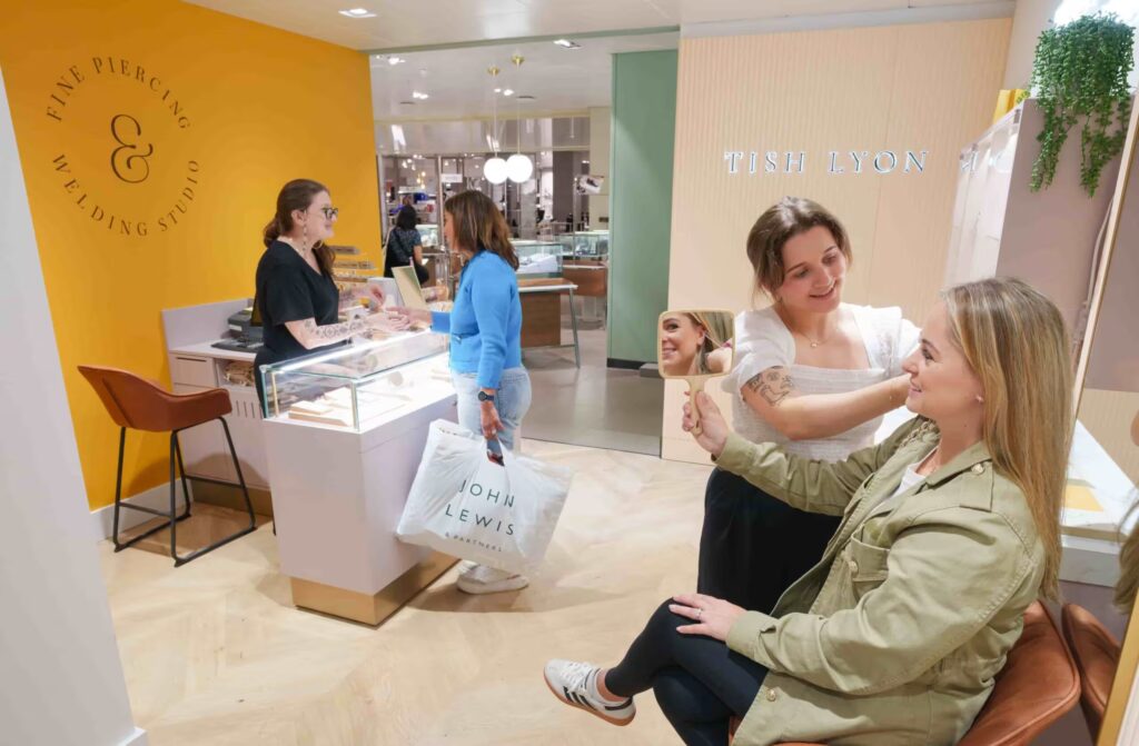 Customers are being served in the Tish Lyons section of John Lewis' department store