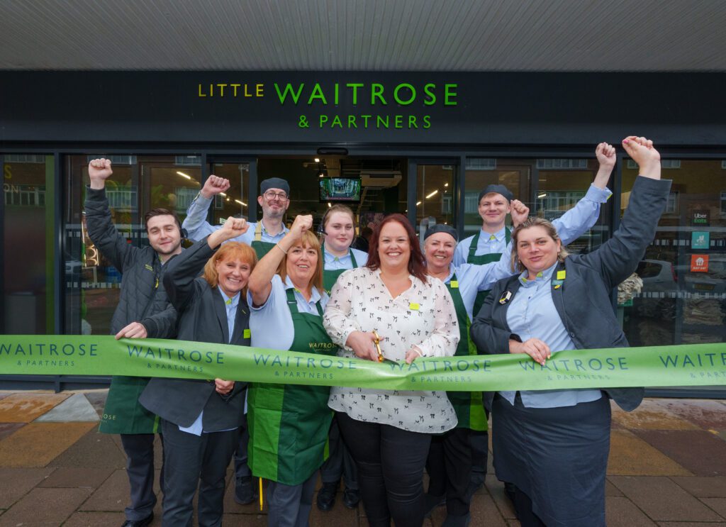 Partners of the new Southwick store celebrating the opening outside the front of the shop.