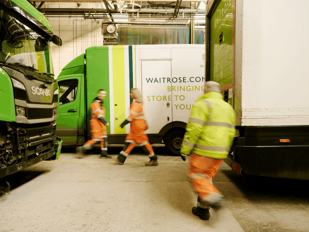 Partners working in one of our vehicle repair workshops. 