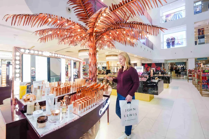 A woman shopping in John Lewis' improved beauty hall at Oxford Street