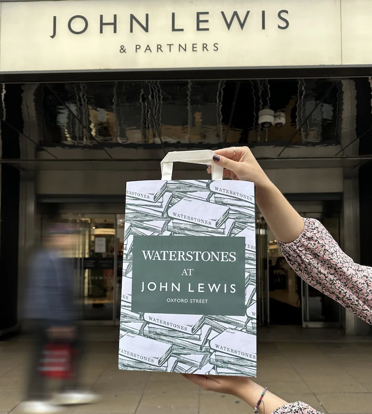 Waterstones bag outside John Lewis Oxford Street shop
