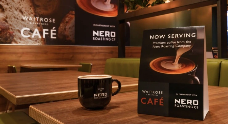 Cafe Nero cup on a table in a Waitrose cafe